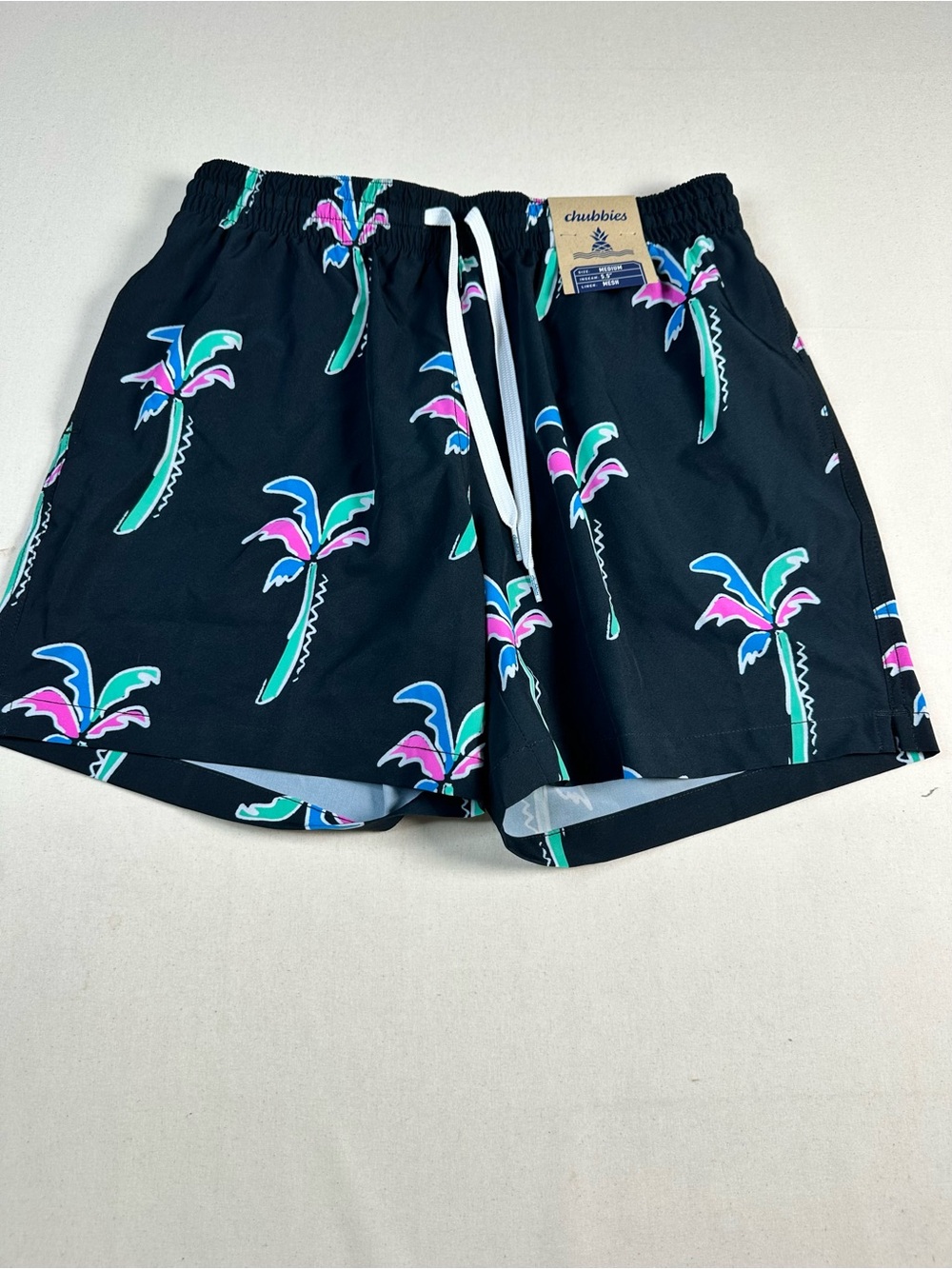 chubbies Black Swim Trunks with Teal Pink and Blue Palm Print medium 5.5”